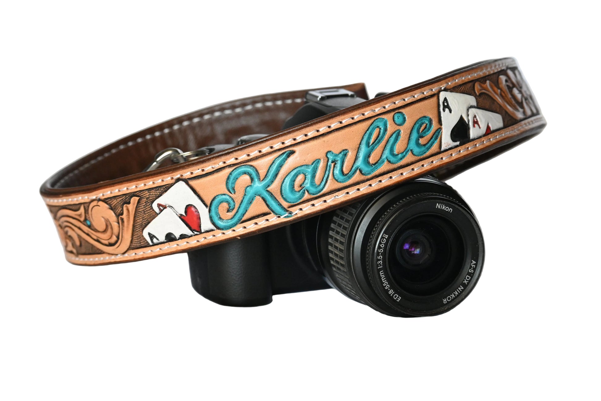 Camera strap with 'Karlie' and playing cards tooled 